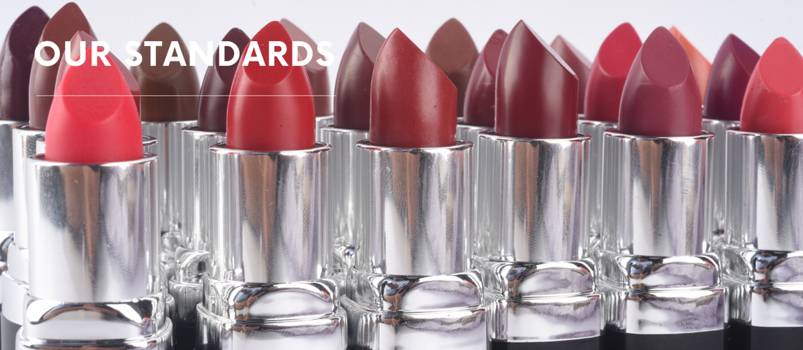 Assorted natural lipstick shades in silver tubes, text reads OUR STANDARDS